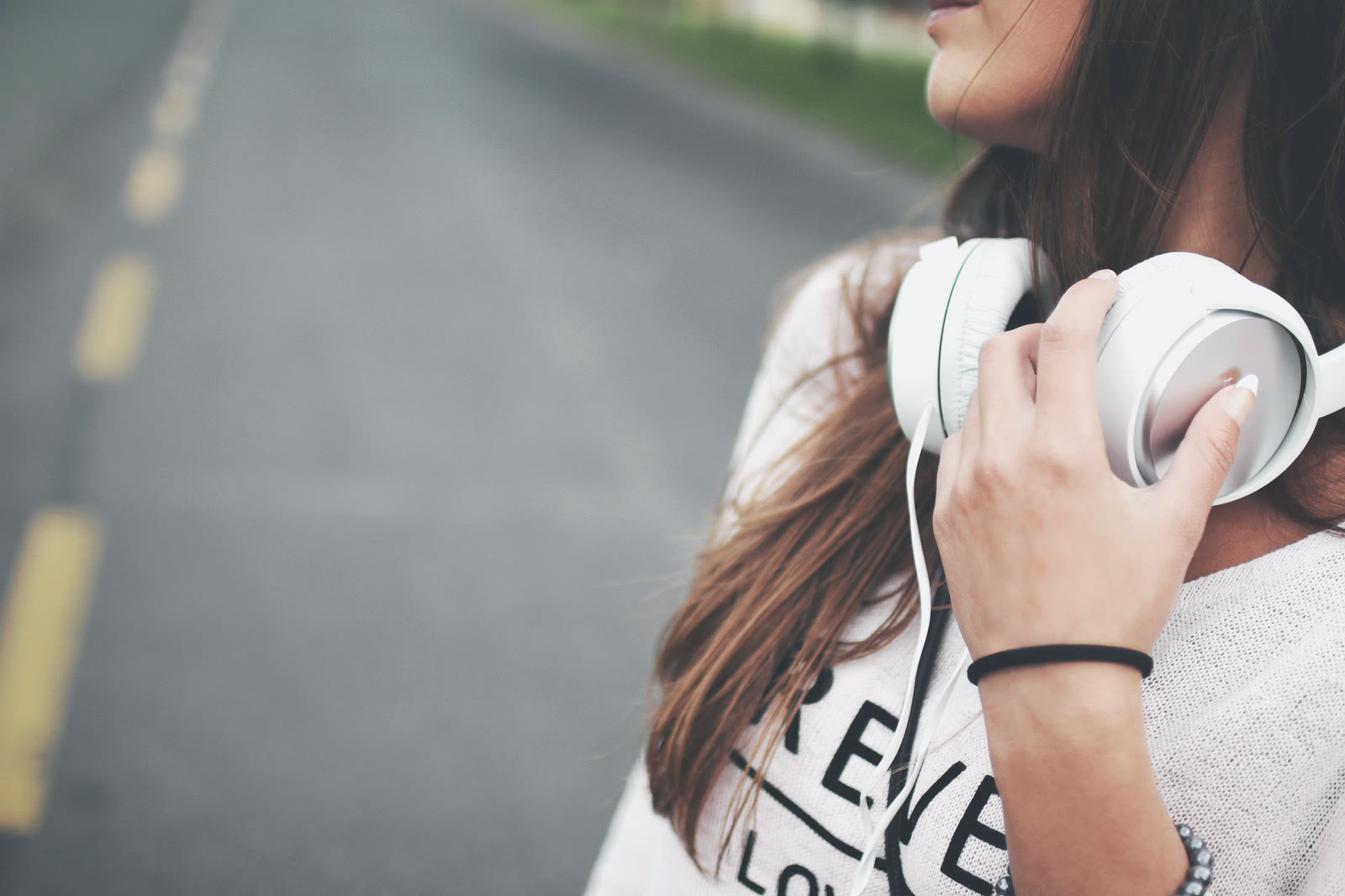 A woman listening with headphones